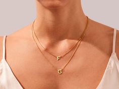 This exquisite piece combines the charm of personalization with a modern, chic design, making it a unique and meaningful accessory. What sets this necklace apart is the double chain design, creating a layered and contemporary look. The two chains enhance the visual impact of your name or initial pendant, making it a true standout piece. • Material: 14k Solid Gold (Stamped 14K for authenticity) • Color Options: Yellow, Rose, White • Chain Style: Cable Chain • Chain Width: 1.10 mm • Clasp Type: Lo Modern Chic Design, Jewelry Hacks, Pendant Making, Double Chain Necklace, Chain Design, Double Chain, Initial Pendant, Chic Accessories, Modern Chic