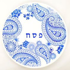 a blue and white plate with the word hebrew written in it