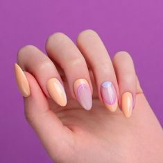 Almond Shaped Nails: Negative Space Details. Peach, periwinkle, and pale pink colors with half-moon shapes. Click through for 30 almond nail ideas. #almondnails #shortalmondnails #manicureideas #nailideas IG: @indigonails