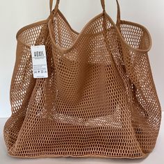 Hoxis Tan Woven Mesh Tote Bag. New With Tag. Sturdy, Nylon Bottom, Nylon Shoulder Straps, Nylon Interior Pocket. Open Design, No Closure. Smoke Free. Casual Brown Bag With Reinforced Handles, Brown Tote Bag With Reinforced Handles, Brown Bag With Double Reinforced Handles, Brown Double Handle Bag With Reinforced Handles, Beige Shoulder Bag With Reinforced Handles, Brown Bags With Reinforced Handles For Daily Use, Tote Shoulder Bag With Reinforced Handles For Shopping, Reinforced Handle Tote Shoulder Bag For Shopping, Beige Shopping Bags With Reinforced Handles