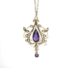 GOLD VICTORIAN OPENWORK AMETHYST AND SEED PEARL PENDANT AND CHAIN Measurements: Chain: 50cms Pendant: 39mm x 21.6mm Stones measure: Amethyst: 11.8mm x 5.9mm pear cut, 3.3mm round Seed Pearls: 1mm - 1.8mm in size x 29 Total weight: 3.7 grams Chemically tested and verified as solid 9ct gold This item will be delivered complete within a black jewellery gift box Please let me know if you have any questions or require more photographs! Antique Yellow Gold Jeweled Necklaces, Antique Yellow Gold Necklaces With Jewels, Ornate Yellow Gold Necklace With Jewels, Classic Yellow Gold Necklace With Jewels, Heirloom Gold Necklace With Jewels, Ornate 14k Stamped Necklaces For Anniversary, Ornate Yellow Gold Jewelry, Ornate Yellow Gold Jeweled Jewelry, Victorian Purple Necklace For Anniversary