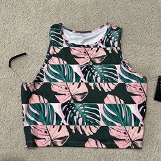 Nike Dri-Fit Crop Fast Tank Top Tropical Palm Print Sz Xl 83% Recycled Polyester 17% Spandex Brand New With Tags Attached Smoke-Free/Pet-Free Home Pink Casual Tops With Tropical Print, Nike Green Sleeveless Top, Trendy Nike Stretch Tops, Trendy Stretch Nike Tops, Pink Sports Crop Top, Trendy Pink Workout Crop Top, Sporty Pink Top For Vacation, Sporty Pink Tops For Vacation, Trendy Pink Crop Top For Workout