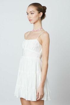 STYLE INFORMATION: You'll be the cutest gal in town in the Mademoiselle White Babydoll Mini Dress! Lightweight black woven fabric, falls from adjustable spaghetti straps, shaping a sweetheart neckline bodice with a ruched bust and front tie. Set-in waist tops a flared mini skirt that ends at a mini hem. Hidden zipper/clasp at back. Lined. DETAILS & CARE: 80% Rayon, 20% Nylon. Polyester Lining. Machine wash cold. Imported. SHIPPING: Orders are processed within 1-2 business days. Packages are ship Babydoll Dress White, Suspender Dress With Spaghetti Straps For Brunch, Brunch Suspender Dress With Adjustable Spaghetti Straps, Brunch Suspender Dress With Spaghetti Straps, Daywear Dress With Sweetheart Neckline And Adjustable Straps, Daywear Dresses With Adjustable Straps And Sweetheart Neckline, Summer Tiered Mini Dress With Fitted Bodice, Sundress With Sweetheart Neckline And Adjustable Straps, Feminine Mini Dress With Smocked Bodice And Spaghetti Straps