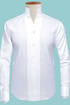 Formal White Tops With Covered Buttons, White Formal Tops With Covered Buttons, Classic White Tops With Covered Buttons, White Stand Collar Shirt With Button Closure, Solid Shirt With Stand Collar And Button Closure, Fitted Shirt With Stand Collar And Button Closure, Fitted Shirt With Stand Collar And Buttons, White Long Sleeve Dress Shirt With Concealed Placket, Classic Long Sleeve Dress Shirt For Daywear