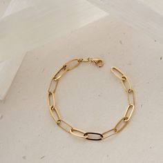 Introducing our 14K Gold Paperclip Chain Bracelet, featuring unique Italian paperclips. This elongated link chain for women is a trending statement piece, perfect as a gift for her. Crafted from genuine 14K solid gold, it ensures lasting quality and sophistication. Elevate your accessory collection with this fashionable and timeless gold bracelet, ideal for any occasion. -- ⋆ This product is designed with Runda's fine handcrafting with sustainable methods. ⋆ Express-insured shipping to the whole Timeless Link Chain Bracelet With Paperclip Chain, Timeless Chain Bracelet With Rectangular Paperclip Links, Timeless Paperclip Chain Bracelet With Rectangular Links, Modern Paperclip Bracelet With Cable Chain For Formal Occasions, Timeless Paperclip Chain Bracelet, Timeless Gold Bracelet With Oval Link Paperclip Chain, Modern Paperclip Chain Bracelet For Formal Occasions, Modern Gold Chain Paperclip Bracelet With Rectangular Links, Luxury Paperclip Bracelet With Oval Link For Everyday