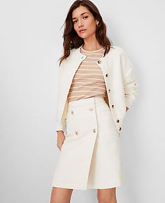 Elevate your weekend wardrobe with the Ann Taylor AT Weekend Mariner Denim Skirt. This ivory A-line skirt combines comfort and style, perfect for relaxed outings or casual chic office days.

- Size: Regular - 12
- Color: Ivory
- Material: 98% Cotton, 2% Spandex
- Length: 19" long
- Fit: Hits at thigh
- Features: Button front, front welt pockets
- Care Instructions: Machine washable

Crafted from a soft cotton blend with a hint of spandex for that extra comfort, this skirt ensures ease of movemen Fall Daywear Bottoms With Button Closure, Beige Bottoms With Button Cuffs For Spring, Spring Beige Bottoms With Button Cuffs, Spring White Bottoms With Snap Buttons, White Bottoms With Snap Buttons For Spring, White Snap Button Bottoms For Spring, White Button-up Bottoms For Spring, White Buttoned Bottoms For Fall, White Bottoms With Button Closure For Daywear