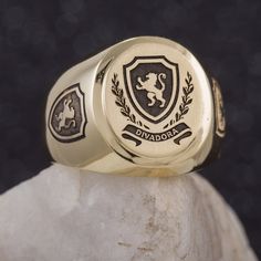 "This signet ring is crafted from 14K solid yelow gold and has a substantial feel to it with a designer quality finish. We can engrave your family crest on the top and sides of the ring and use our unique hand-crafted black finish to add contrast. We can also help you design a unique family crest using your choice of shield, symbols and text for an additional fee (please contact us for design pricing). ITEM DETAILS Item# SRGC006-FC Metal: 14K Solid Gold ITEM DIMENSIONS Width Widest Point: 18.23m Luxury Engraved Signet Ring For Commemoration, Luxury Oval Signet Ring Stamped 14k, Luxury Engraved Ring With Polished Finish For Commemoration, Luxury Engraved Ring For Commemoration With Polished Finish, Luxury Oval 14k Stamped Signet Ring, Luxury Oval Signet Ring With Hallmarks, Oval Signet Ring With Polished Finish For Commemoration, Luxury Oval Engraved Ring With Engraving Option, Luxury Personalized Oval Signet Ring