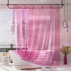 a bathroom with pink curtains and a bathtub