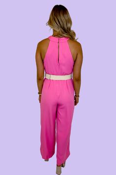 Hot pink jumpsuit Criss cross chest Halter neckline Open keyhole back Natural woven trim belt 92% Polyester, 8% Spandex Chic Pink Halter Neck Jumpsuit, Pink Sleeveless Jumpsuit For Date Night, Sleeveless Pink Jumpsuit For Date Night, Hot Pink Jumpsuit, Hot Pink Jumpsuits, Pink Jumpsuit, Halter Neckline, Guinea Bissau, British Indian