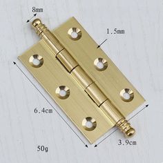 brass plated door hinge with holes and screws