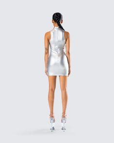 It’s not about looking pretty, it's about looking otherworldly 😏 Made from metallic silver-coated stretch jersey and complete with custom logo hardware trim, a mock neck, and a bodycon fit for a look that will have everyone trying to reach your level ✨ Metallic Bodycon Dress For Club And Party Season, Sleek Bodycon Dress For Party Season, Metallic Sleeveless Bodycon Dress, Sleek Fitted Bodycon Dress For Party Season, Metallic Stretch Mini Dress For Club, Metallic Bodycon Dress For Club, Metallic Bodycon Mini Dress For Club, Sleek Stretch Bodycon Club Dress, Fitted Disco Bodycon Dress For Night Out