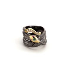 18K yellow gold & black rhodium silver snake ring with 0.15 cttw green sapphires, 0.06 cttw purple sapphires, and 0.09 cttw G-H/SI diamonds.  All sales are final. Please see our full cancellations & returns policy here Serpent Ring, Snake Ring Silver, Silver Bodies, Gold Face, Snake Jewelry, Purple Sapphire, Professional Jewelry, Crescent Moon Necklace, Snake Ring