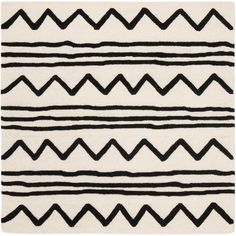 a black and white rug with wavy lines on the bottom, in various sizes and colors