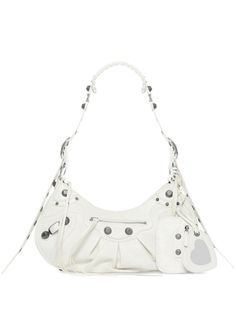 Crafted in luxurious arena leather, this gorgeous crossbody bag features intricate metal stud detailing for an edgy yet sophisticated look. Comes with a removable flat pouch handbag featuring two zippered pockets for added versatility. Includes a detachable heart-shaped mirror for on-the-go touch ups. Can be worn on the shoulder or crossbody thanks to the adjustable shoulder strap/handle with a comfortable padded shoulder pad and leather embroidered edges. Designed with a convenient zip closure Mirror Bag, Mini Coin Purse, Bag Charms, Leather Handbags Crossbody, Balenciaga Bag, Balenciaga Shoes, Leather Cap, Strap Top, Zip Pouch