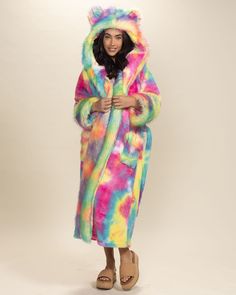 Luxury Robe for Women - Classic, Faux Fur Robe Our women's luxury robe combines our famous rainbow bear blacklight-activated faux fur with a luxuriously plush, colorful, double-sided, cozy body fabric. The signature hood and ears add a touch of fun, while the Peta-Approved-Vegan & Oeko-Tex-Certified faux fur guarantees cruelty-free, ethical manufacturing. This luxury bathrobe is just as whimsical as it is cozy! Rainbow Bear Characteristics PLAYFUL • POSITIVE • SOCIALDo you have the Spirit of the Faux Fur Outfit, Poncho Men, Faux Leggings, Robe For Women, Luxury Robes, Hood Hat, Fur Clothing, Classic Coats, Fur Hood