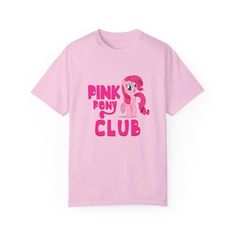 A comfy and classic tee featuring Pinky Pie from My Little Pony with the phrase 'Pink Pony Club'. This shirt exudes a fun and playful vibe, perfect for fans of the show or anyone who loves cute and whimsical designs. Ideal for casual outings or lounging at home, this t-shirt is a great addition to any fan's wardrobe. Perfect for birthdays, comic con, or any My Little Pony themed events. Product features - Available in sizes S to 4XL - Double-needle stitching for durability - Garment-dyed fabric Pony Shirt, Pink Club, Pink Pony Club, Chemise Rose, Pony Club, Chappell Roan, Themed Events, Club Shirts, Comfort Colors