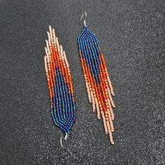 Navy blue orange beaded earrings Seed bead earrings Chandelier | Etsy Handwoven Orange Beaded Earrings For Gift, Handwoven Orange Beaded Earrings As Gift, Orange Beaded Fringe Dangle Earrings, Orange Handwoven Dangle Beaded Earrings, Beaded Fringe Long Drop Earrings For Festivals, Dangle Beaded Earrings With Fringe For Crafting, Festival Beaded Fringe Long Drop Earrings, Orange Bohemian Tassel Earrings With Dangling Beads, Adjustable Orange Beaded Fringe Earrings