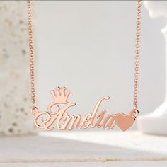 Every little girl is a princess, which is why she should have a Crown Name Necklace around her neck. Any girl would love to wear her very own personalized princess necklace. You can choose 18k gold finish, Rose gold or Sterling silver. All girls should feel like princesses when wearing this necklace! Customized Rose Gold Necklace For Personalized Gift, Customized Rose Gold Charm Necklaces For Anniversary, Customizable Rose Gold Name Necklace For Birthday, Customized Rose Gold Charm Necklace For Anniversary, Customizable Rose Gold Dainty Charm Necklace, Customizable Rose Gold Necklaces For Birthday Gift, Customized Rose Gold Necklace For Birthday Gift, Customizable Rose Gold Necklaces, Rose Gold Nameplate Necklace For Birthday Gift