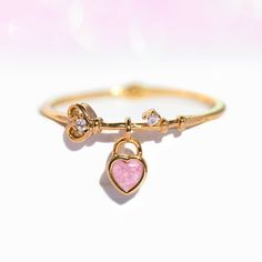 You know you've got the key to our heart! Why not pair it with this adorable locket-inspired charm ring? The Key To My Heart Ring features a whimsical key-like band with a charming baby pink heart shaped locket dangling off of it. Lock this cutie down and tap 'Add to Cart'! Strawberry Ring, The Key To My Heart, Heart Shaped Locket, Charm Ring, Silver Heart Ring, Rings Collection, Key To My Heart, Necklace Chain Lengths, Stud Set