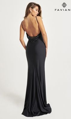 a woman in a black evening gown with an open back