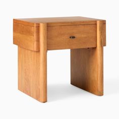 a small wooden table with one drawer open