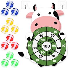 a cartoon cow holding a wheel of fortune with four colors around it and the numbers on each side