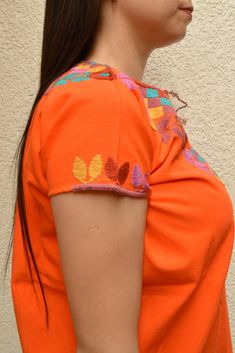 Blouse multicolored handmade by Mexican artisans. . It is important to mention that absolutely all the process is done by hand, so the size, shape and color can varybetween pieces. . Measurements:↕ 26 in↔ 20 6/7 in Orange Embroidered Cotton Blouse, Traditional Handmade Multicolor Tops, Artisan Multicolor Cotton Top, Traditional Multicolor Handmade Tops, Traditional Multicolor Cotton Embroidered Top, Orange Cotton Blouse With Floral Embroidery, Orange Embroidered Festival Tops, Traditional Orange Cotton Tops, Orange Embroidered Tops For Festival