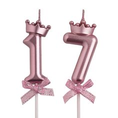 a pink cake topper with the number seven on it