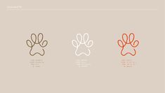 four different colored dog paws on a beige background