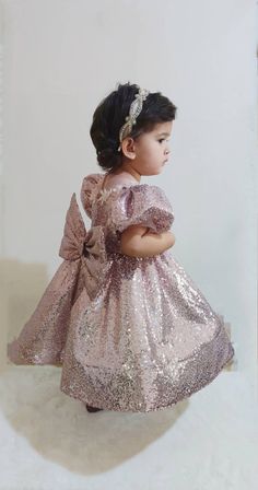 Your little one will be the most beautiful princess in this sparkly puffy dress! Princess Style Glitter Dress For Dress-up, Fitted Glitter Princess Dresses, Fitted Princess Style Glitter Dresses, Fitted Princess Style Dresses With Glitter, Sequin Glitter Tulle Dress For Dress-up, Fitted Glitter Dress For Pageant, Fitted Glitter Dress For Pageants, Short Sleeve Glitter Dress For Party Season, Cute Puff Sleeve Wedding Dresses