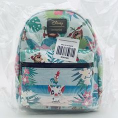 Loungefly Disney Moana Floral Mini Backpack Check out my other listings - Many Disney and Kids/Baby Clothes Loungefly Disney Moana Pua Hei Hei Kakamora Floral Mini Backpack Ready for a tropical getaway? This mini backpack from Moana features Pua and Hei Hei on the front zipper pocket. There is an allover tropical floral print with the Kakamora. Adjustable straps, interior drop pocket and burnished gold tone hardware. 8 3/4" x 4 1/2" x 10 1/4" Polyurethane Adjustable straps Front zipper pocket Imported By Loungefly Please e-mail with any questions prior to purchase.  Fast shipping same day or one business day handling time.  Please see my seller feedback as I am a trusted seller. Disney Green Travel Bags, Green Disney Travel Bag, Disney Travel Backpack, Disney Style Backpack For Travel, Themed Multicolor Travel Bag, Green Disney Backpack For Travel, Disney Green Travel Backpack, Green Disney Travel Backpack, Moana Pua