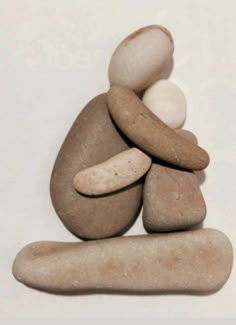 some rocks stacked on top of each other with white and brown pebbles in the middle