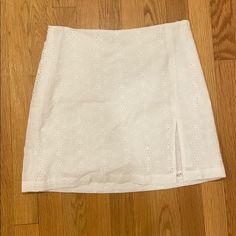 White Mini Skirt With Eyelet Detail And Slit On The Side, Double Lined, Never Worn, Nwt, Fits Size 4 2023 Wishlist, Skirts White, White Mini Skirt, White Skirt, On The Side, White Skirts, Mini Skirt, Casual Shorts, Womens Skirt