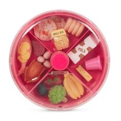 a pink plastic container filled with lots of food