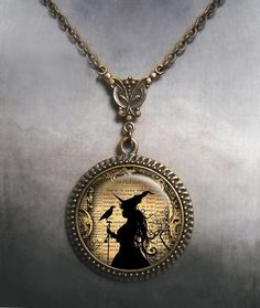 "Witch and Raven Art Nouveau necklace ~ A beautiful and unique bit of Halloween art, perfect for your Elvira outfit.  The glass pendant is set into a necklace featuring a beautifully detailed reproduction of an Art Nouveau connector and it's a great gift for your favorite witch or Wiccan.  The pendant measures 1-3/16\" across (30mm) and the artwork is covered by a crystal clear, domed glass cabochon which protects and enhances the image for a truly beautiful effect!  The necklace closes with a l Fantasy Necklaces For Halloween Gift, Vintage Necklace For Halloween, Fantasy Costume Jewelry For Halloween, Vintage Halloween Costume Necklaces, Fantasy Halloween Costume Jewelry, Vintage Costume Necklaces For Halloween, Vintage Halloween Jewelry Gift, Gothic Halloween Jewelry With Round Pendant, Gothic Halloween Round Pendant Jewelry