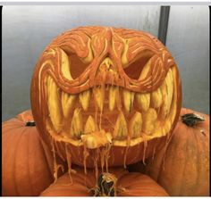 carved pumpkins are stacked on top of each other