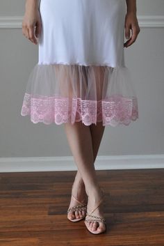 "Light Pink Lace/Tulle Lace Ruffle Trim - Slip Extender. An exquisite accessory for your wardrobe, this feminine slip worn with your skirt or dress will make you feel very special ! It is made of white nylon with elastic waistband and 9\" inches pink lace/tulle ruffle and trimmed with pink lace 4\" or your choice of color. Choose from 9 colors of tulle and lace. Standard length is - 25\" and petite is 21\". Available in color: #1-Red #2-White #3-Brown #4-Cream/Ivory #5-Fuchsia #6- Black #7- Ligh Slip Extender, Skirt Extender, Dress Extender, Sheer Clothing, Half Slip, Silk Knit, Silk Slip, Lace Ruffle, Beautiful Lingerie