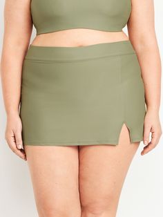 elastic waist vented front built-in briefs sits at belly button fitted hits high on thigh models are approx.  5'9" and wear sizes s (4), l (12), and xl (18)machine wash according to the care instruction label High-waist Bottoms With Built-in Shorts And 4-way Stretch, Green Swim Skirt With Built-in Shorts, Stretch High Waist Mini Skirt With Built-in Shorts, Summer Green 4-way Stretch Tennis Skirt, Green 4-way Stretch Tennis Skirt For Summer, Green Tennis Skirt With 4-way Stretch For Summer, Solid Skort With Wide Waistband And Stretch, Solid Color Stretch Skort With Wide Waistband, Solid Stretch Skort With Wide Waistband