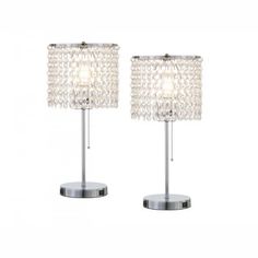 a pair of lamps with crystal beads on them