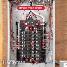 an electrical panel with multiple wires attached to it and the words never ever touch written in red