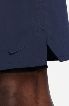 the back of a man's shorts with nike logo on it