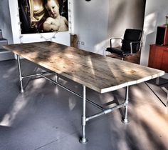 a wooden table sitting in the middle of a room