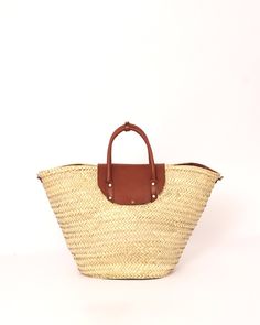 Do you want to look stylish and hippy? Get your hands on this handmade straw bag. It's high quality, eco-friendly, and handcrafted by women in Morocco. Its design is unique and timeless. Get yours now! we are proud to introduce our signature straw french bag to you. it is handmade by our talented artisan who has been working with us for years. this beautiful bag has a unique design that you would find nowhere else. the light and durable material are ideal for taking the bag on your adventures. S Eco-friendly Woven Leather Beach Bag, Spring Beach Bag In Natural Woven Leather, Eco-friendly Beach Bag With Woven Leather And Natural Fiber, Brown Woven Leather Beach Bag For Spring, Eco-friendly Beach Bag With Woven Leather, Spring Natural Woven Leather Beach Bag, Spring Season Natural Woven Leather Beach Bag, Bohemian Straw Bag With Woven Leather In Natural Color, Summer Woven Leather Bags In Natural Color