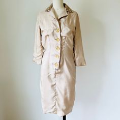 1950s beige silk sheath dress with velveteen collar, 5 large buttons down the front. Fully lined. This dress would work well for a 50s costume, or theater or film dress needing a rumpled look. Unfortunately, although I used cold water there was slight shrinkage when I hand washed it so it is not smooth as in its original state. It has a nifty half belt across the back.  Small size Measurements with an inch of room for comfort Bust up to 35" Waist up to 27" Hips up to 35" Exact measurements are t 50s Costume, Silk Sheath Dress, Robes Vintage, Hip Ups, Large Buttons, Theatre Costumes, Theater, Sheath Dress, Dress Clothes For Women