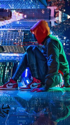 a man sitting on top of a glass table in front of a cityscape