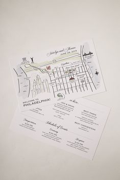 two wedding programs on top of each other with the city map in the middle one