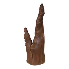 a wooden sculpture of a hand reaching up