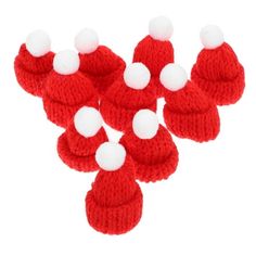 red and white knitted mittens with pom - poms on the top