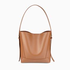 Caramel Classic Everyday Bucket Shoulder Bag, Classic Everyday Satchel Shoulder Bag, Classic Everyday Canvas Shoulder Bag, Classic Crossbody Hobo Bag For Daily Use, Classic Large Capacity Hobo Shoulder Bag, Classic Large Capacity Shoulder Bag For Daily Use, Classic Hobo Bag With Adjustable Strap For Shopping, Versatile Office Bucket Shoulder Bag, Everyday Cognac Shoulder Bag With Detachable Strap