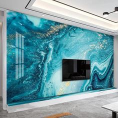 a living room with a large blue marble wall mural on the wall and a flat screen tv mounted to the wall